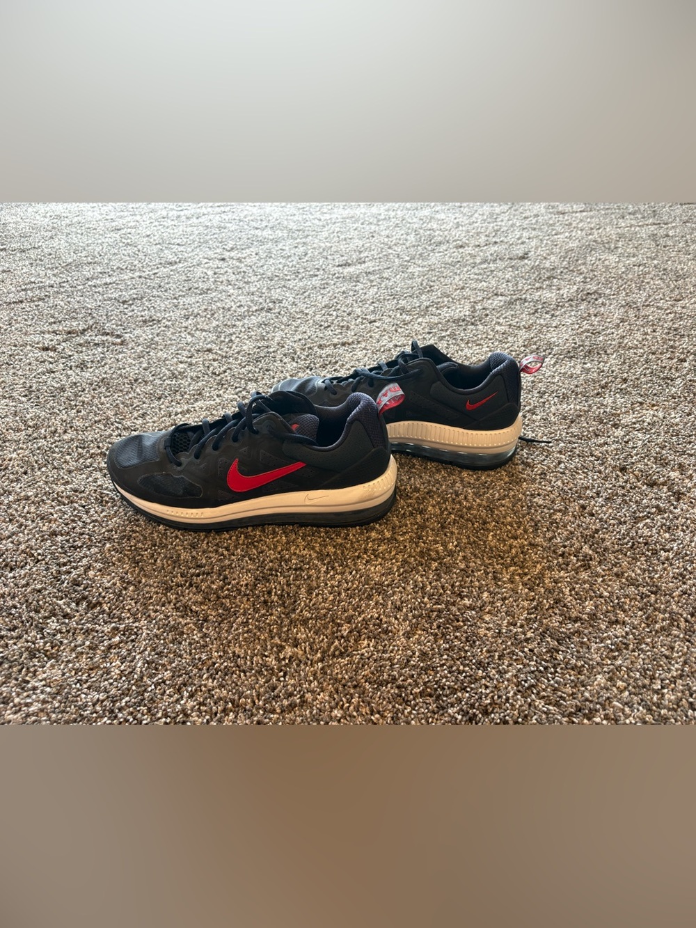 Nike Black Sneakers with Red Swoosh and White Midsole